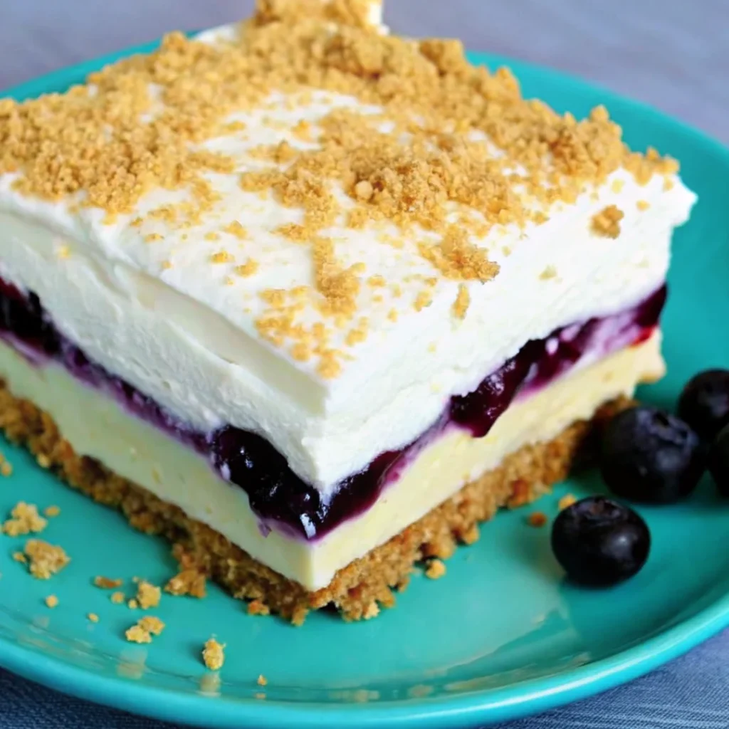 No bake lemon blueberry dessert garnished with fresh blueberries and mint, perfect for spring desserts.