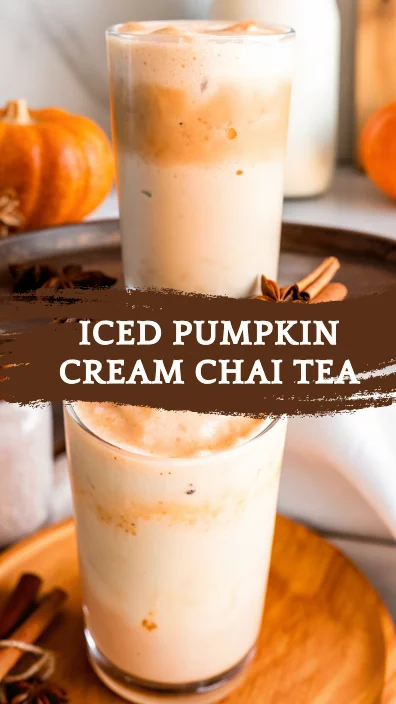 Iced pumpkin cream chai tea with pumpkin foam and fall spices in a glass.