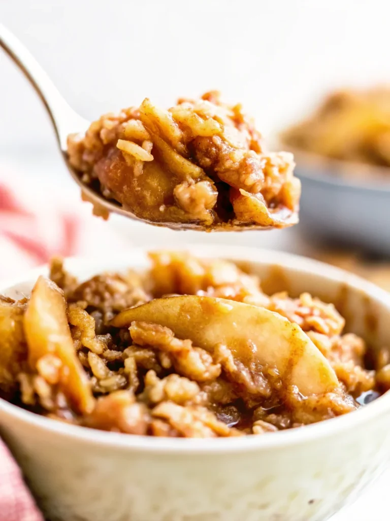 Perfect peach crisp recipe with golden oat topping and tender peach slices served in ceramic bowl