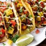 Colorful summer mexican tacos with fresh vegetables, corn tortillas, lime wedges and salsa showcasing vibrant summer mexican recipes