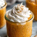 Creamy pumpkin chia seed pudding in a glass bowl topped with pumpkin seeds and cinnamon, showcasing healthy fall breakfast recipe