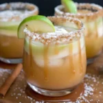 Caramel Apple Mocktail with brown sugar rim and apple slice garnish in elegant glass