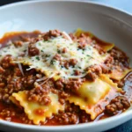 Crockpot Ravioli Lasagna Dinner with melted cheese and tender pasta layers in slow cooker, perfect easy weeknight meal