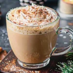 Christmas fireside coffee with whipped cream and cinnamon garnish served in rustic ceramic mug