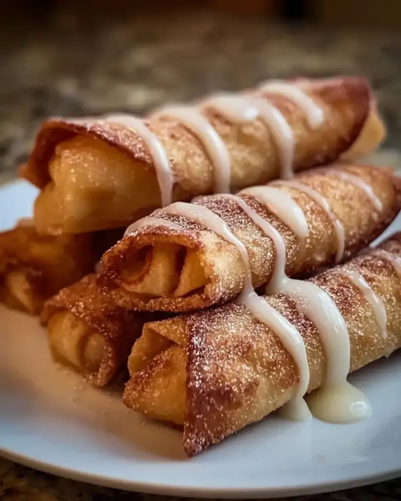 A delicious plate of Peach Cobbler Egg Rolls Recipe